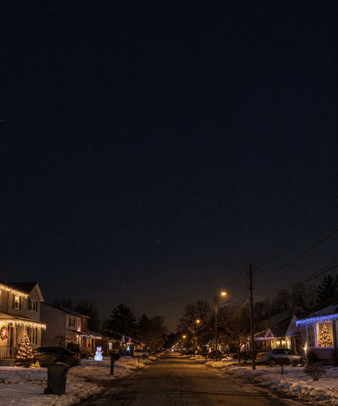An ordinary American street decorated for Christmas at night
